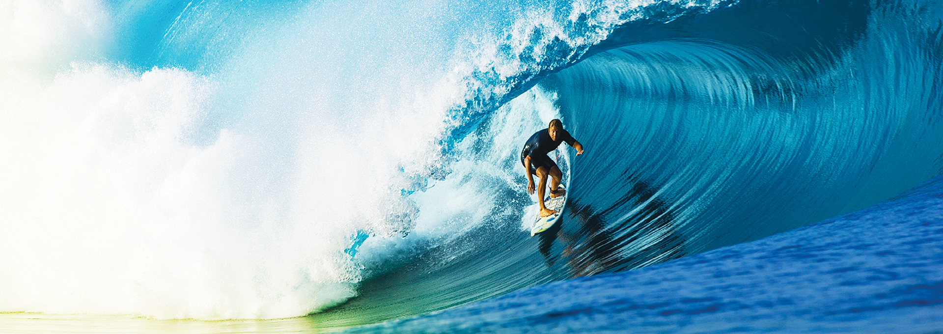 Surfer in a wetsuit riding a wave