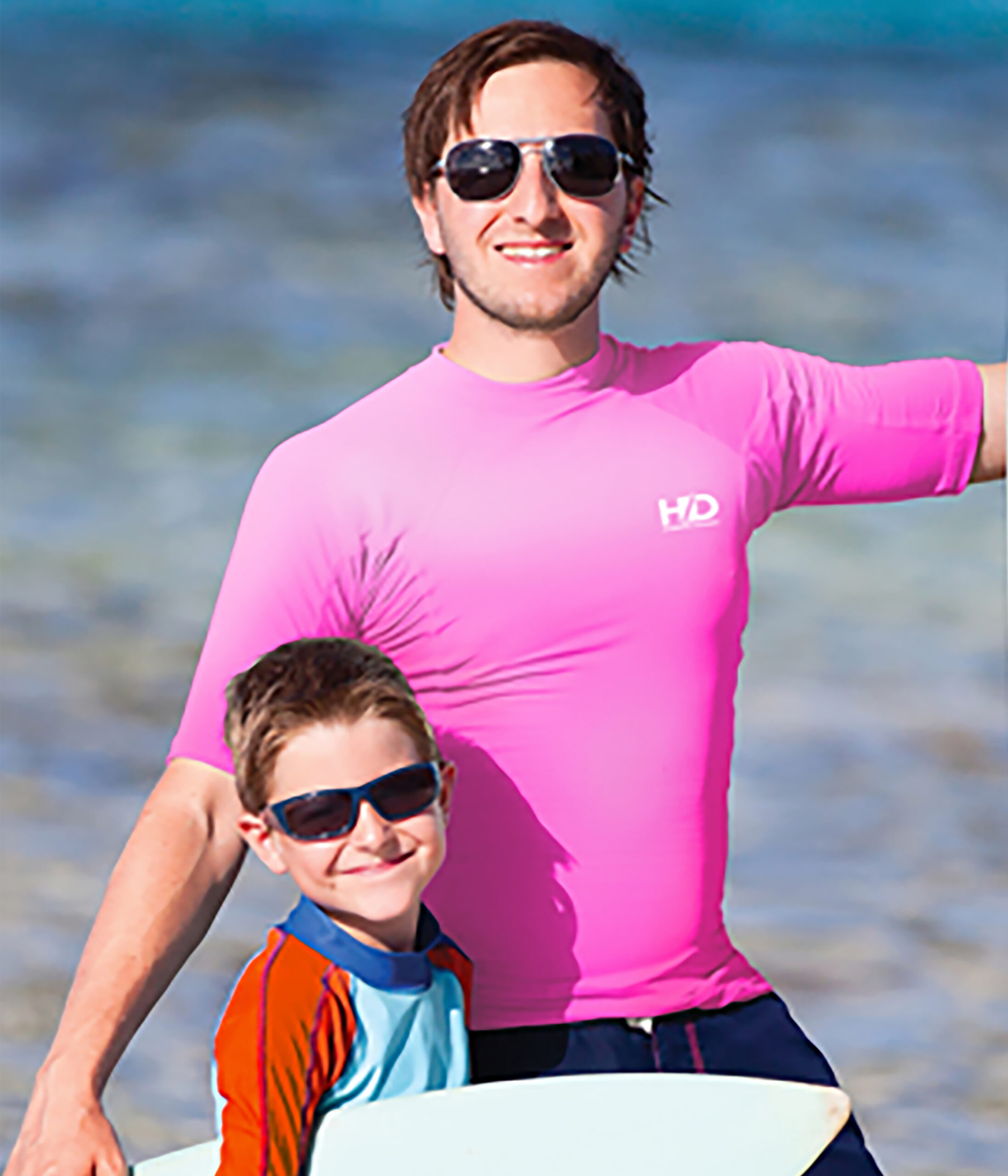 Father and son in rash guards