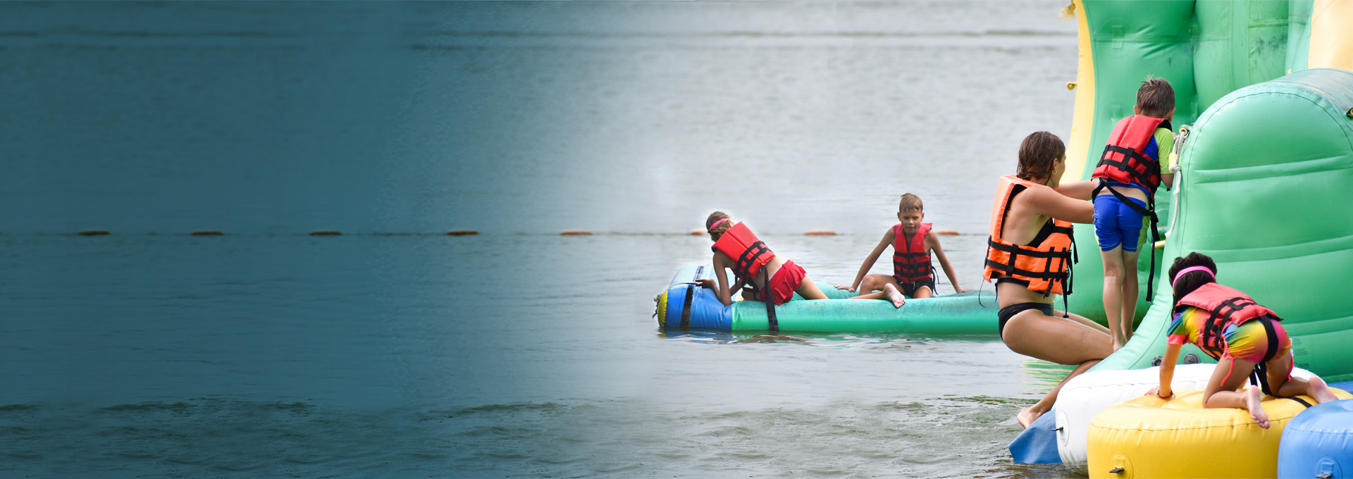 Children in life jackets on a towable