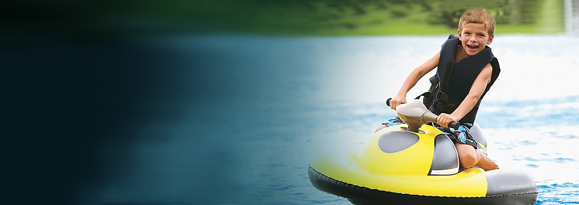 Boy riding a motorized inflatable